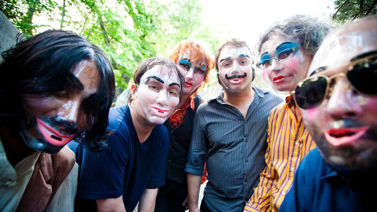 a group of people with transparent masks on
